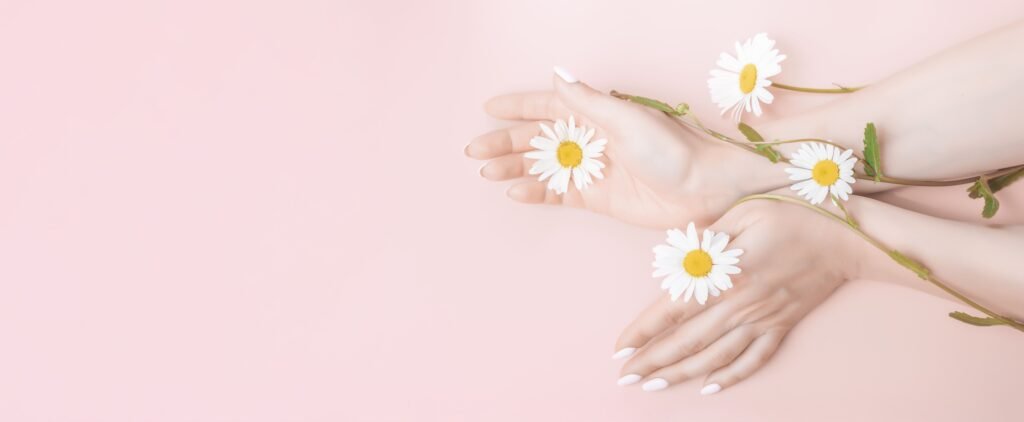 women-hands-with-flowers-natural-beauty-hand-cosmetics-with-flower-extract-product (1)